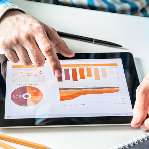 Facility manager reviewing performance charts and reports